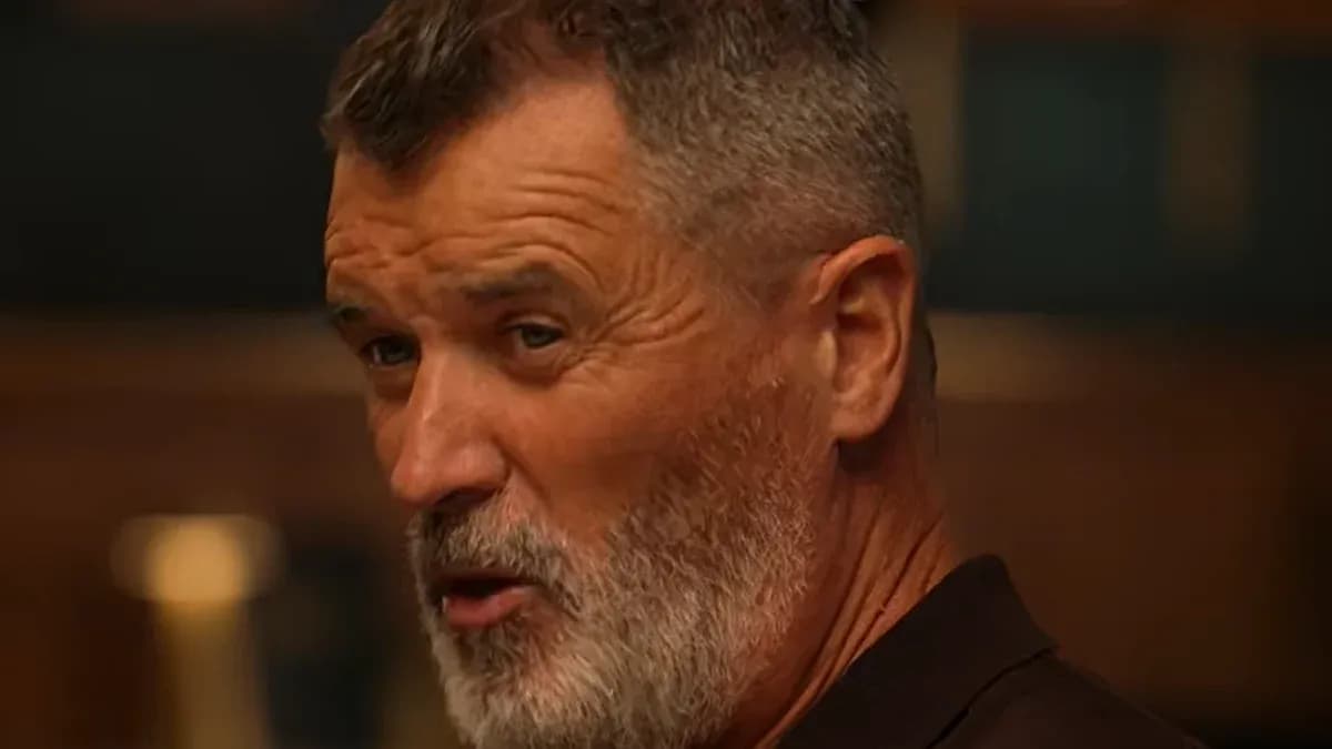 Man with gray beard speaking in a dimly lit room Man with gray beard speaking in a dimly lit room