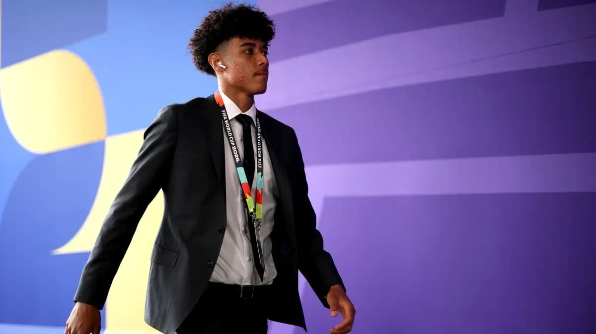 Player walking in formal attire at event venue Player walking in formal attire at event venue