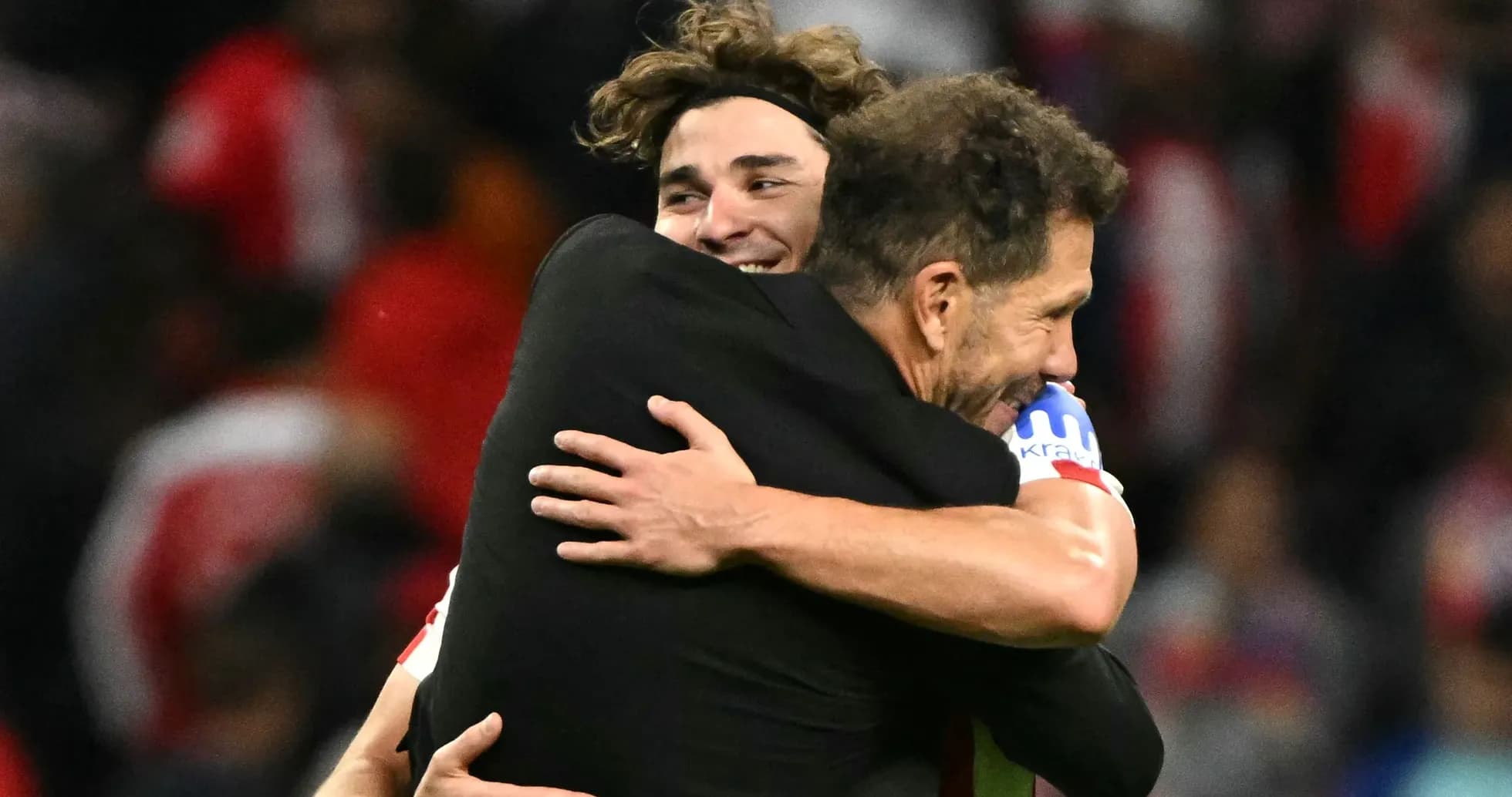 Two players embracing after a match celebration Two players embracing after a match celebration