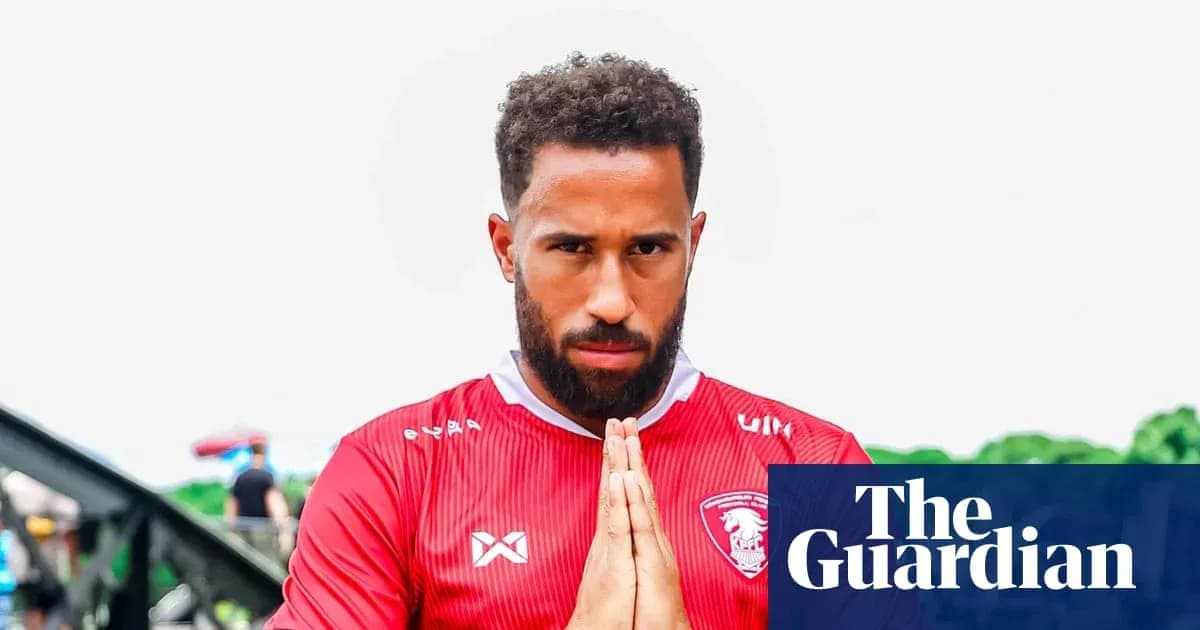 Player in red jersey posing with hands together Player in red jersey posing with hands together