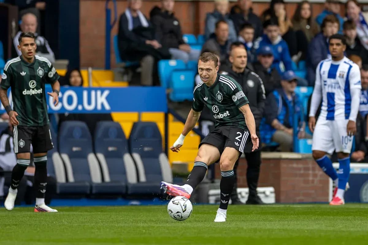 Player kicking ball during match at stadium Player kicking ball during match at stadium
