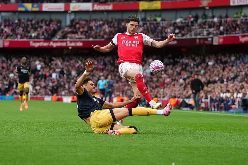 Player tackling during West Ham vs Arsenal match Player tackling during West Ham vs Arsenal match
