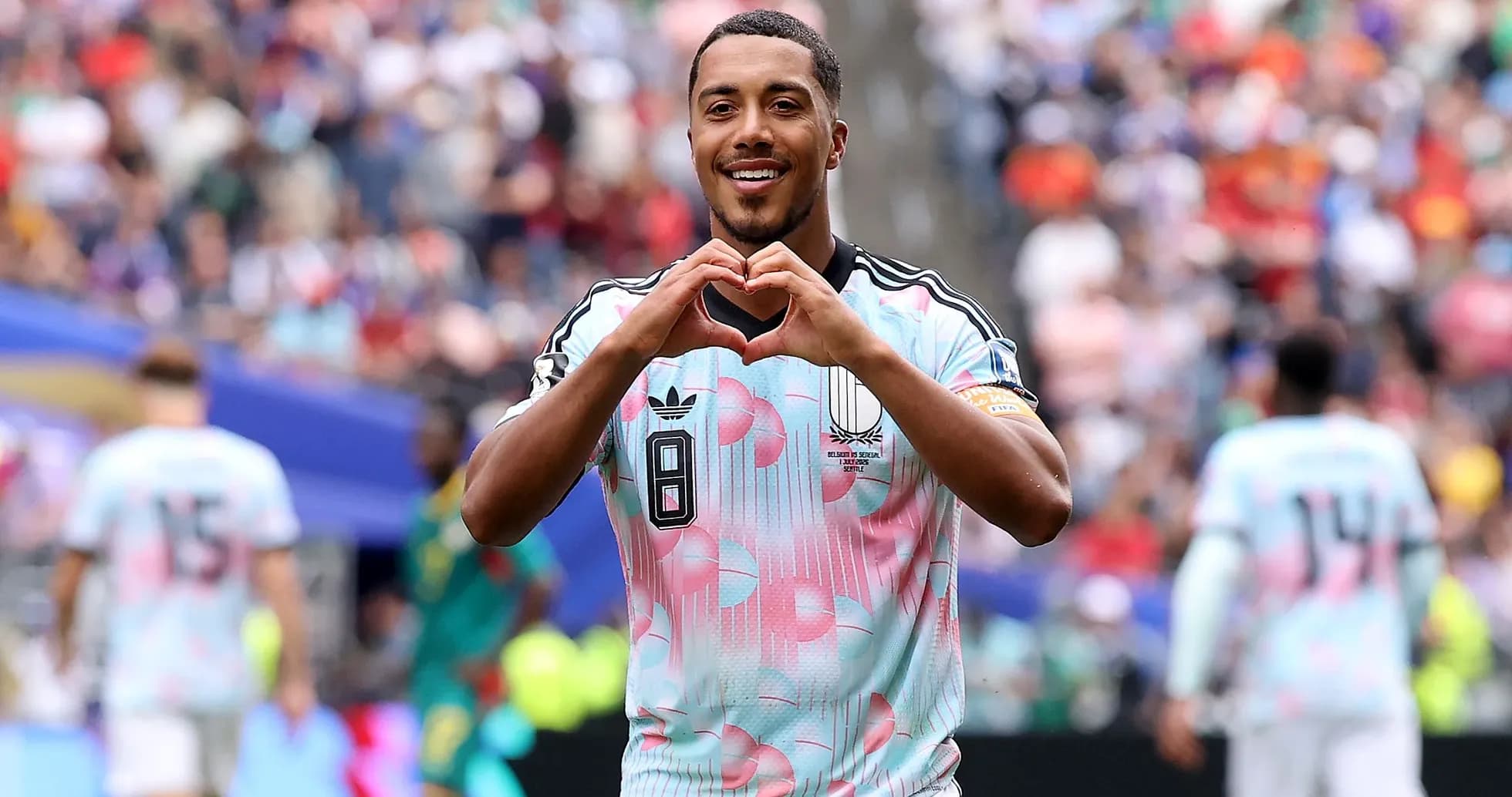 Player celebrating with heart gesture during match Player celebrating with heart gesture during match