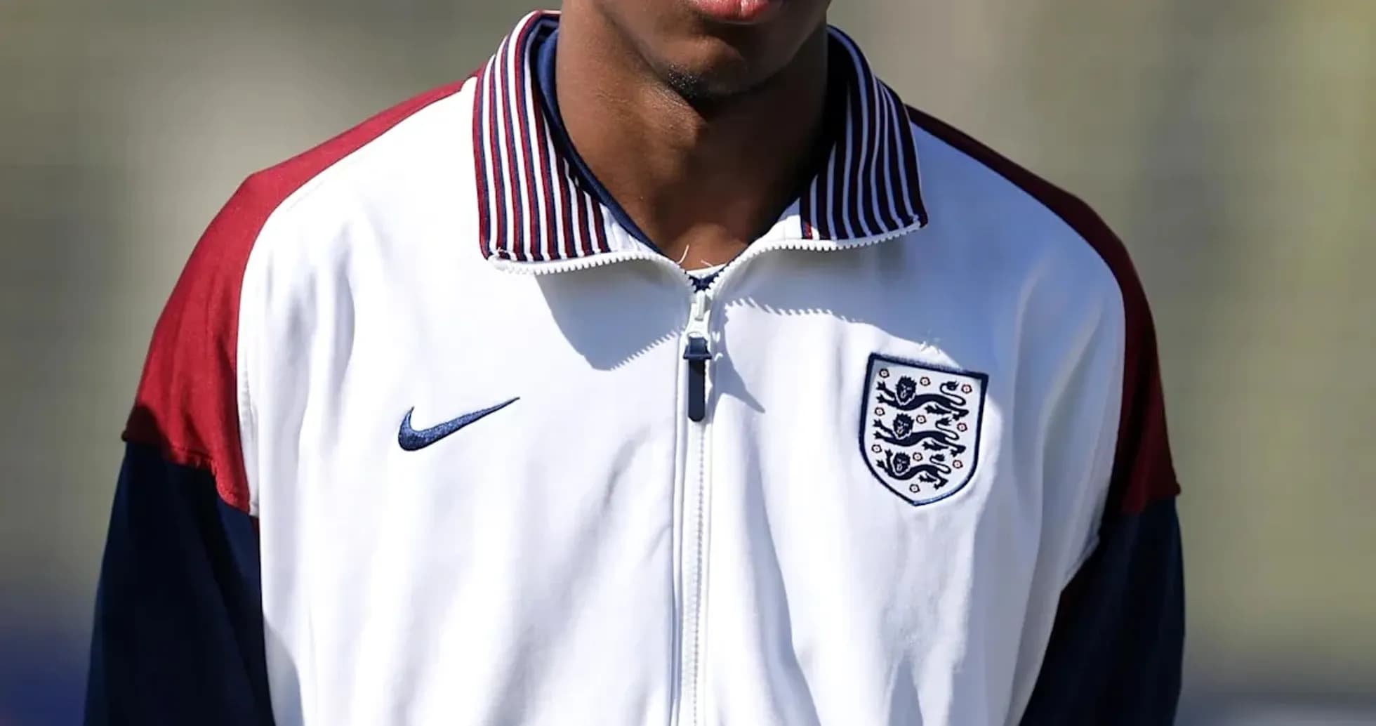 Player in England training jacket during session Player in England training jacket during session