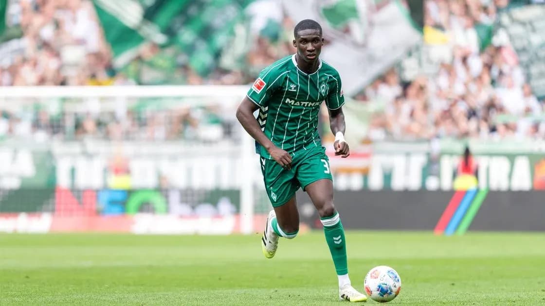 Player running on the pitch during a match Player running on the pitch during a match