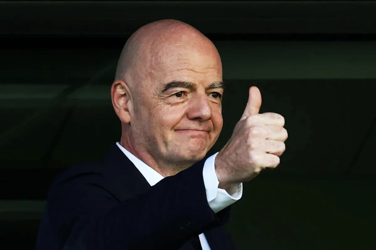Official giving a thumbs up from a balcony Official giving a thumbs up from a balcony