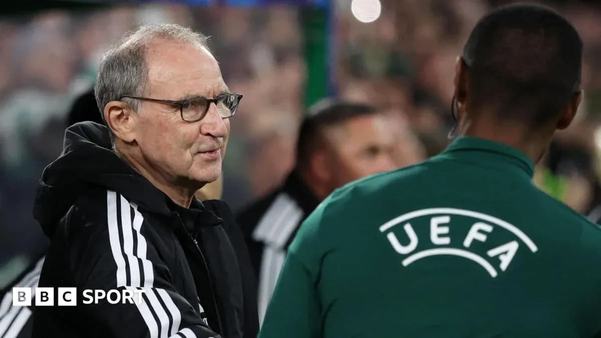 Manager interacting with UEFA official during match Manager interacting with UEFA official during match