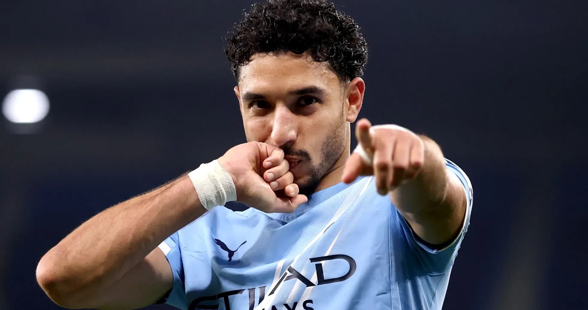 Player celebrating and pointing after scoring a goal Player celebrating and pointing after scoring a goal