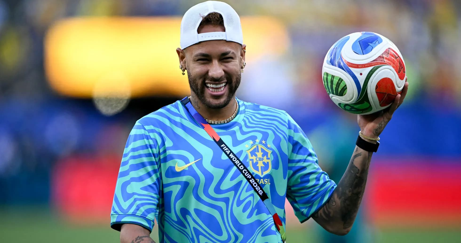 Player holding a soccer ball in a blue shirt Player holding a soccer ball in a blue shirt