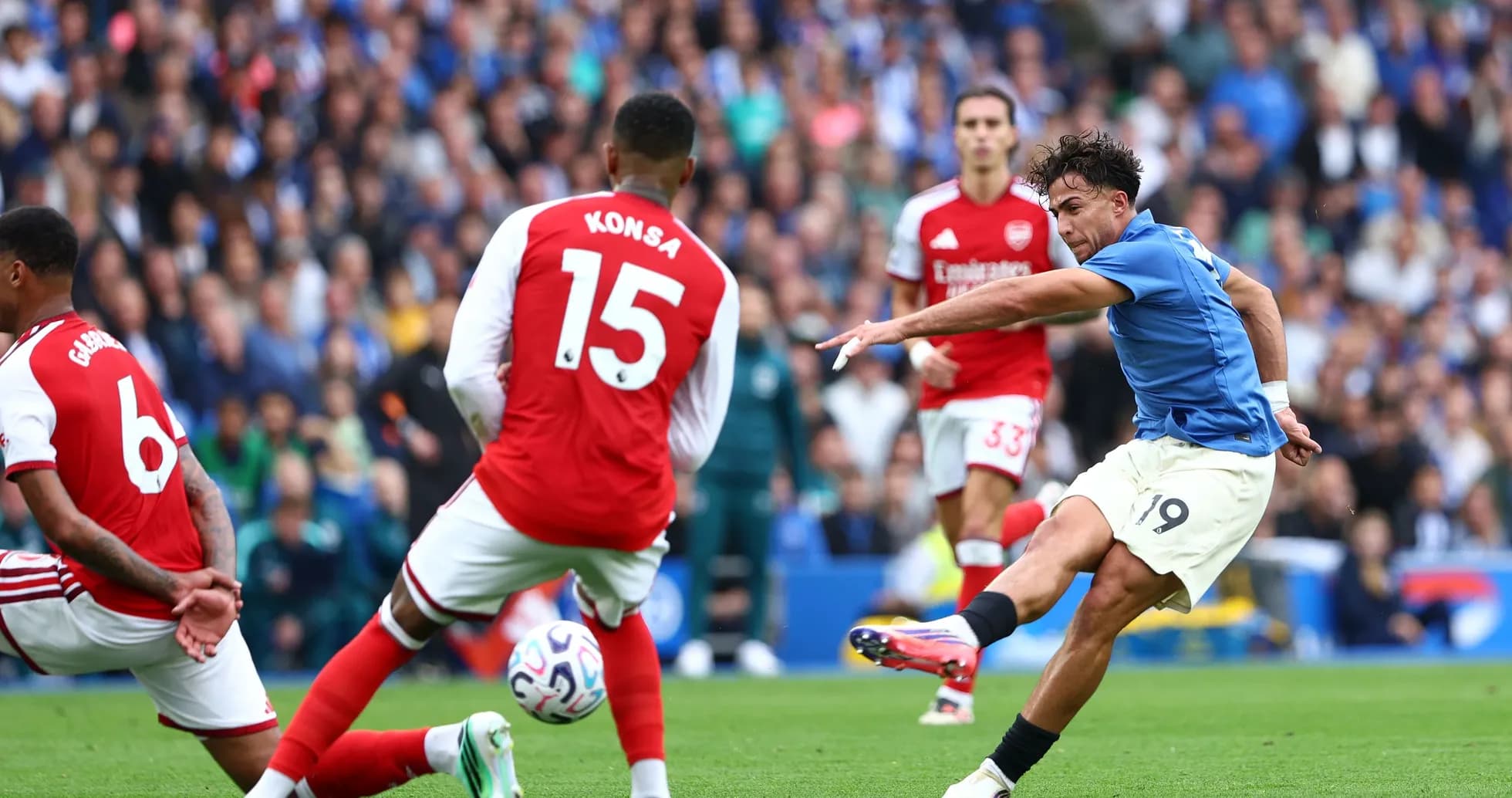Player shooting on goal during match against Arsenal Player shooting on goal during match against Arsenal