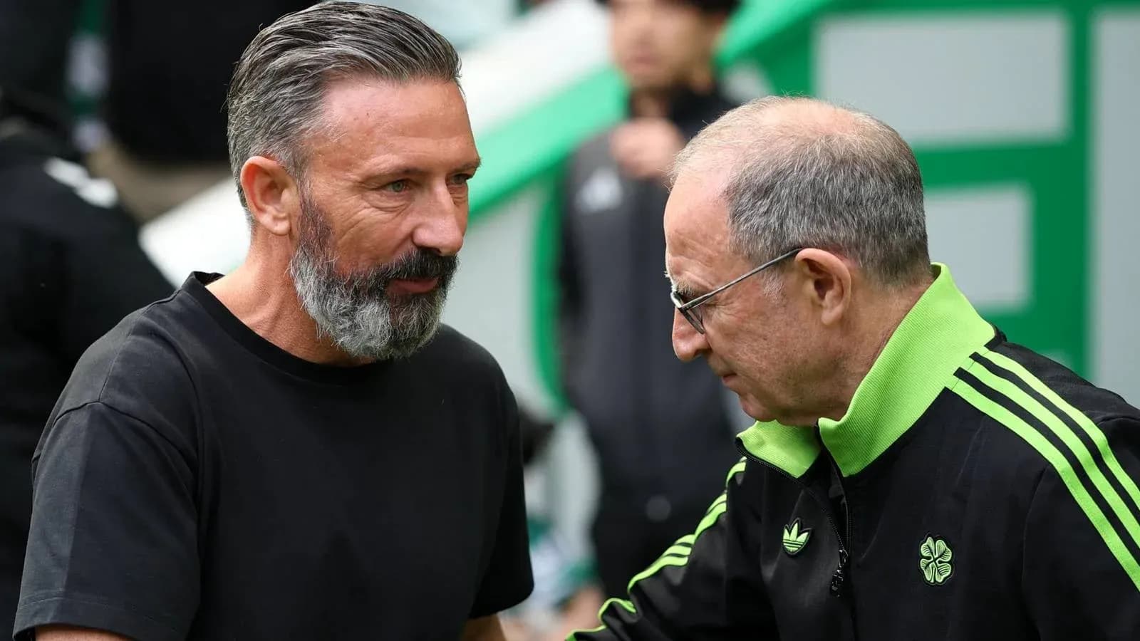 Two football managers shaking hands before the match Two football managers shaking hands before the match