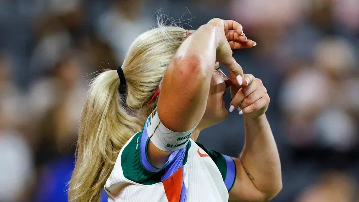 Athlete adjusting headband during sports event Athlete adjusting headband during sports event