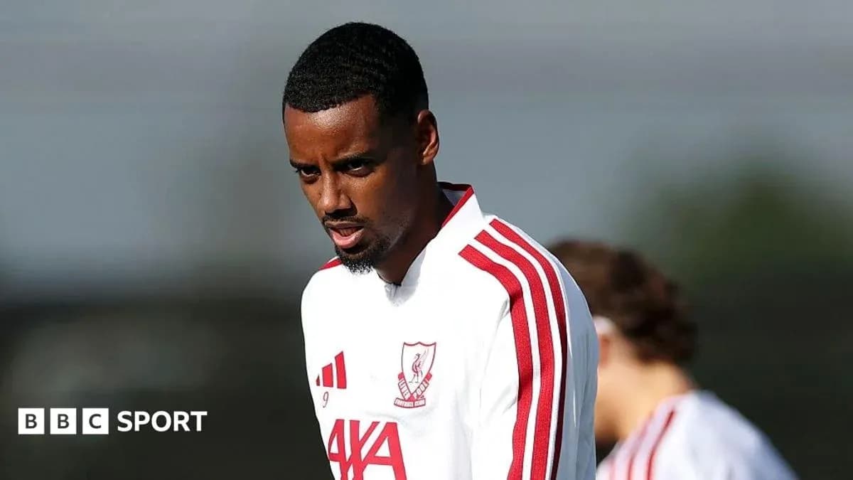 Player training in white jersey with red stripes Player training in white jersey with red stripes