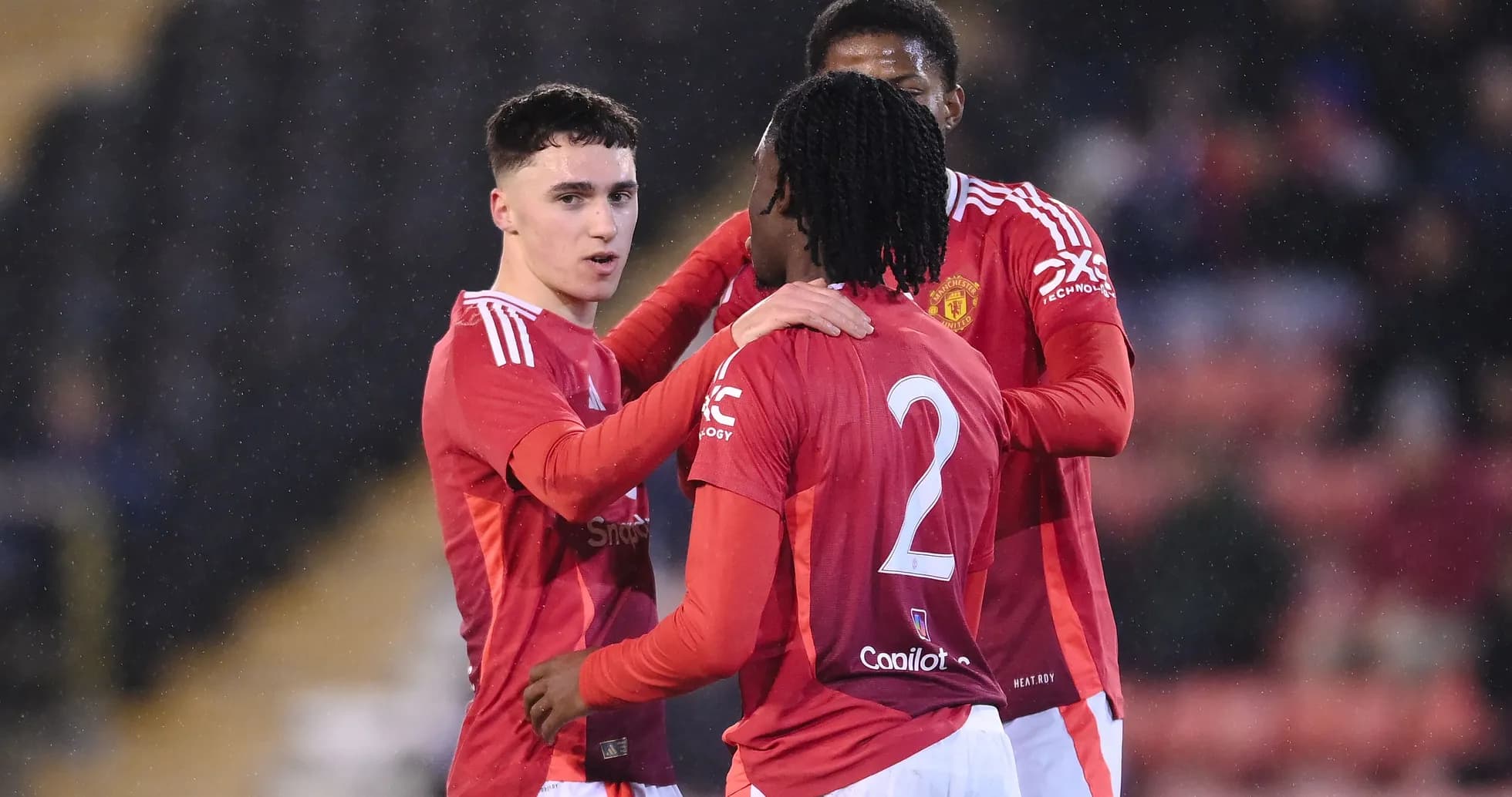 Manchester United players celebrating a goal together Manchester United players celebrating a goal together