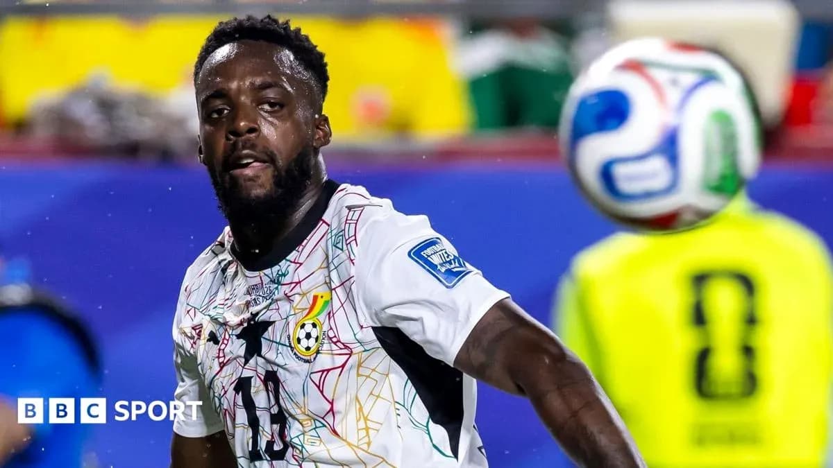 Player from Ghana chasing the ball during match Player from Ghana chasing the ball during match