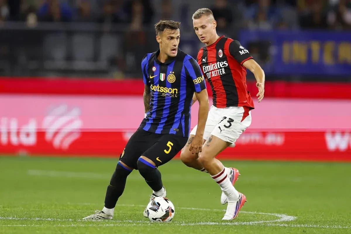 Inter Milan and AC Milan players competing for the ball Inter Milan and AC Milan players competing for the ball