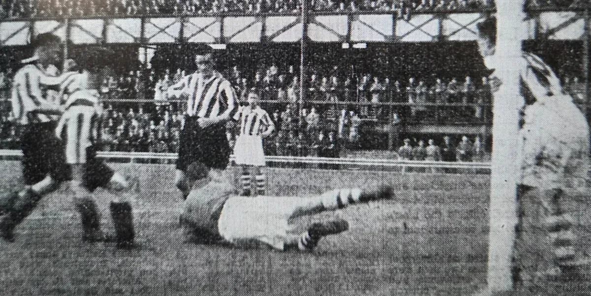 Players contesting during a historic football match Players contesting during a historic football match