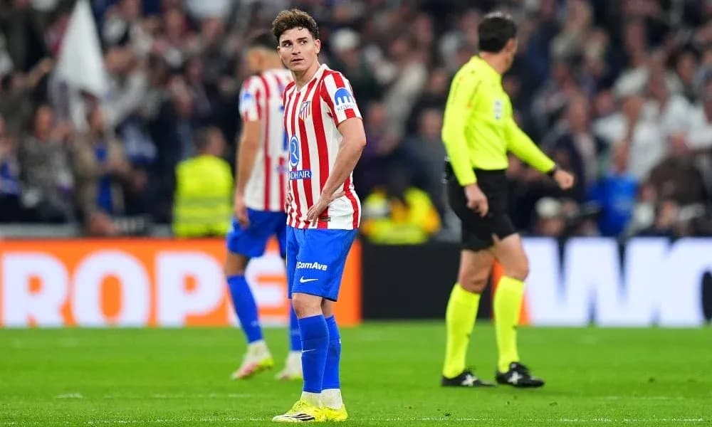 Atletico Madrid player reacting during match with referee Atletico Madrid player reacting during match with referee