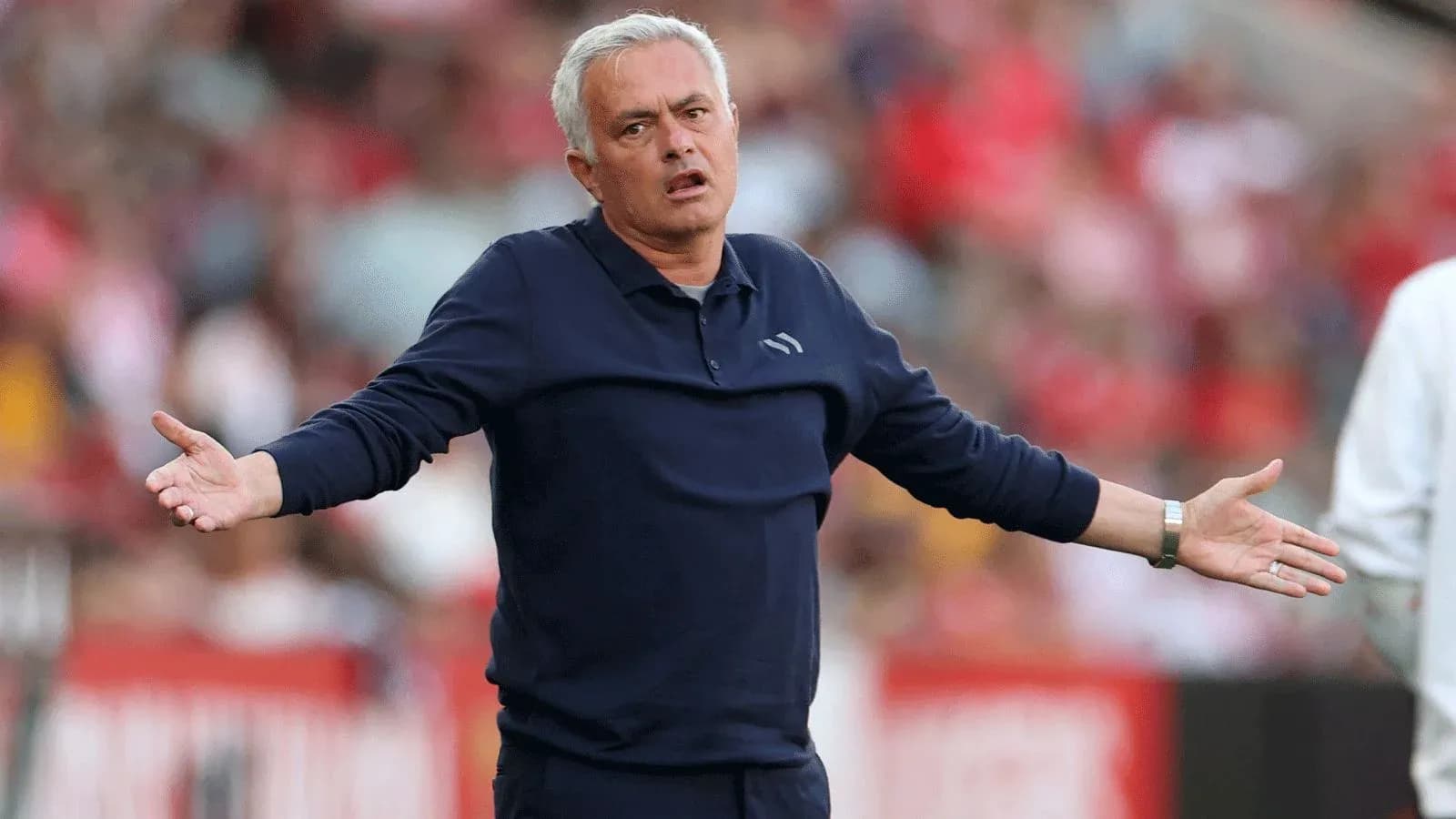 Manager gesturing during a match on the sideline Manager gesturing during a match on the sideline