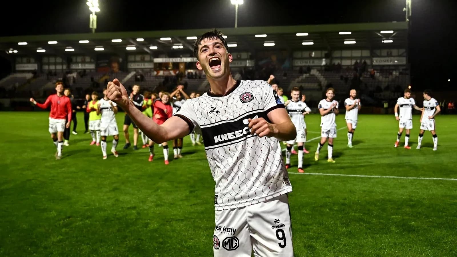 Player celebrating with teammates after a match Player celebrating with teammates after a match
