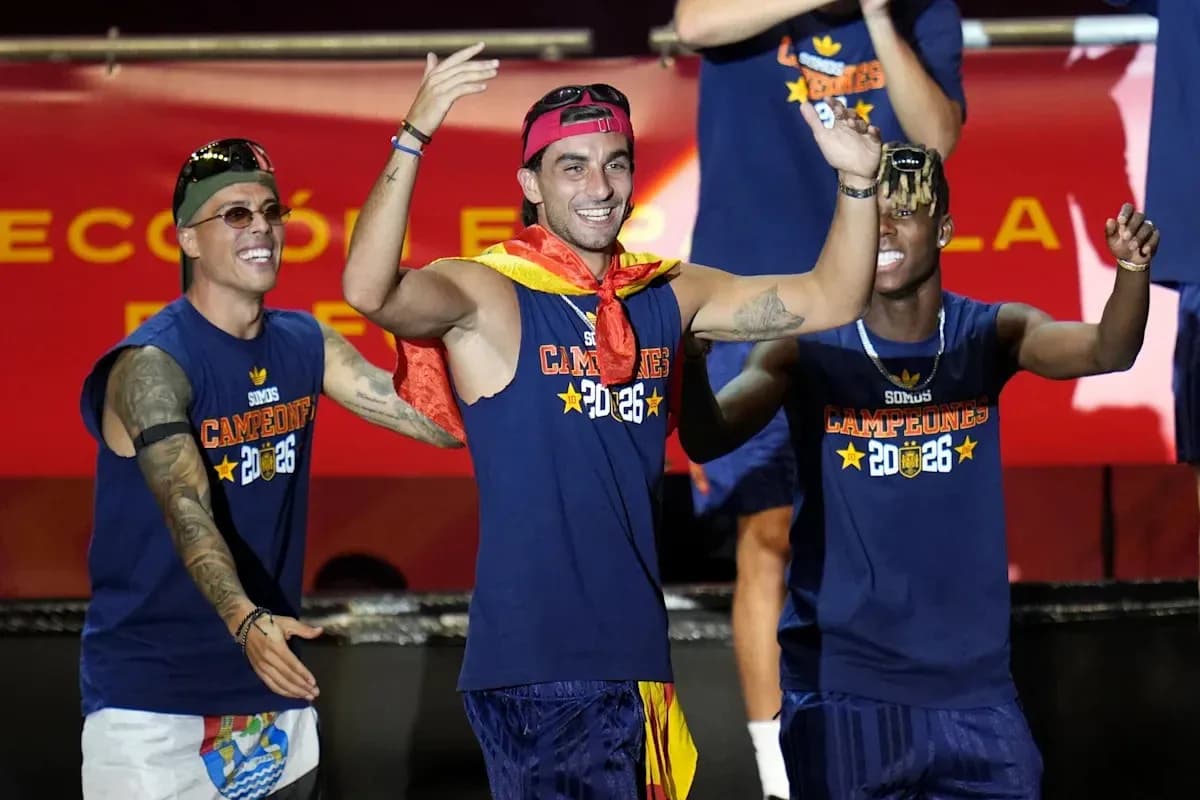 Players celebrating with a trophy on stage Players celebrating with a trophy on stage