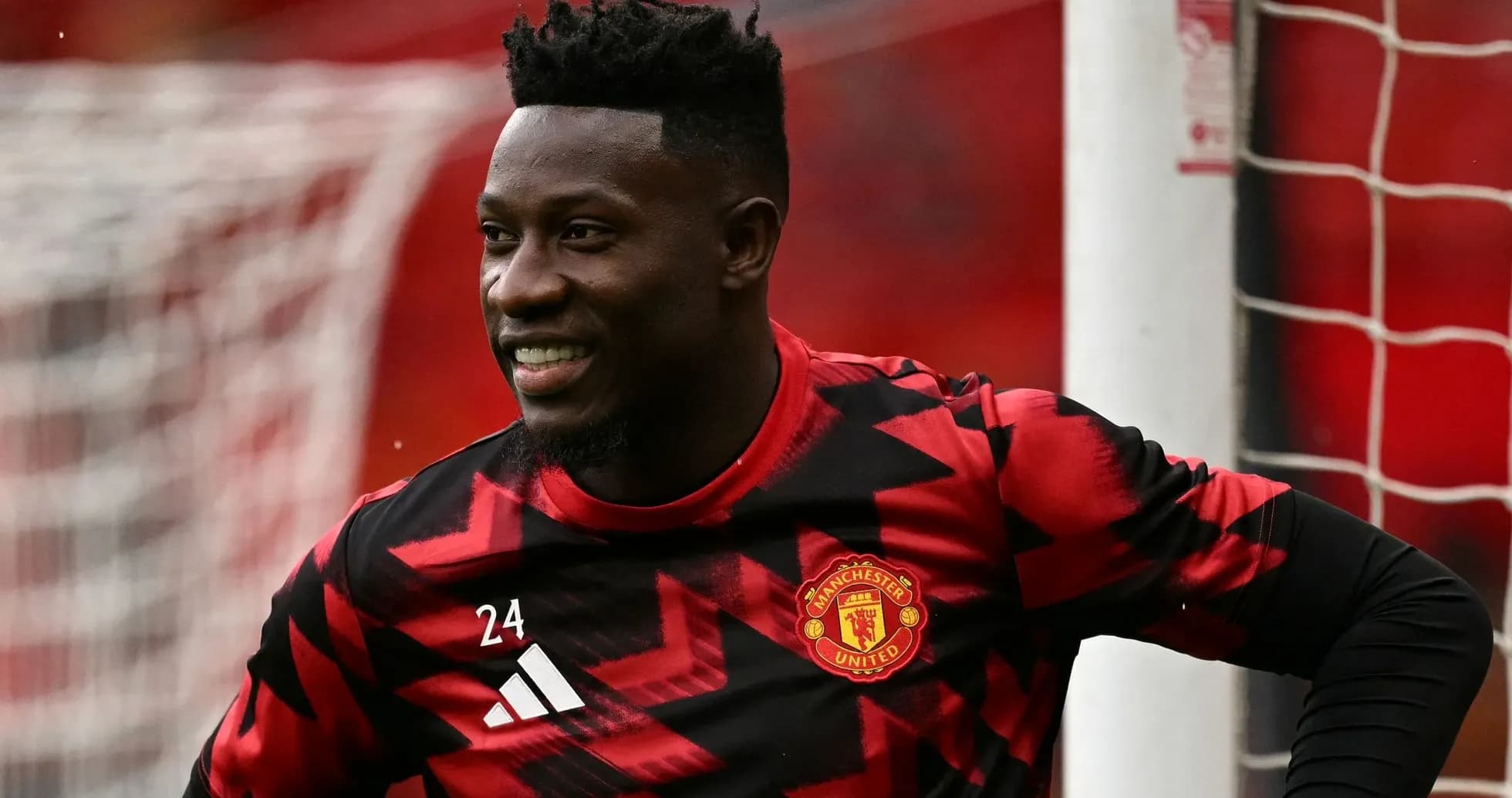 Goalkeeper in Manchester United training kit smiling Goalkeeper in Manchester United training kit smiling