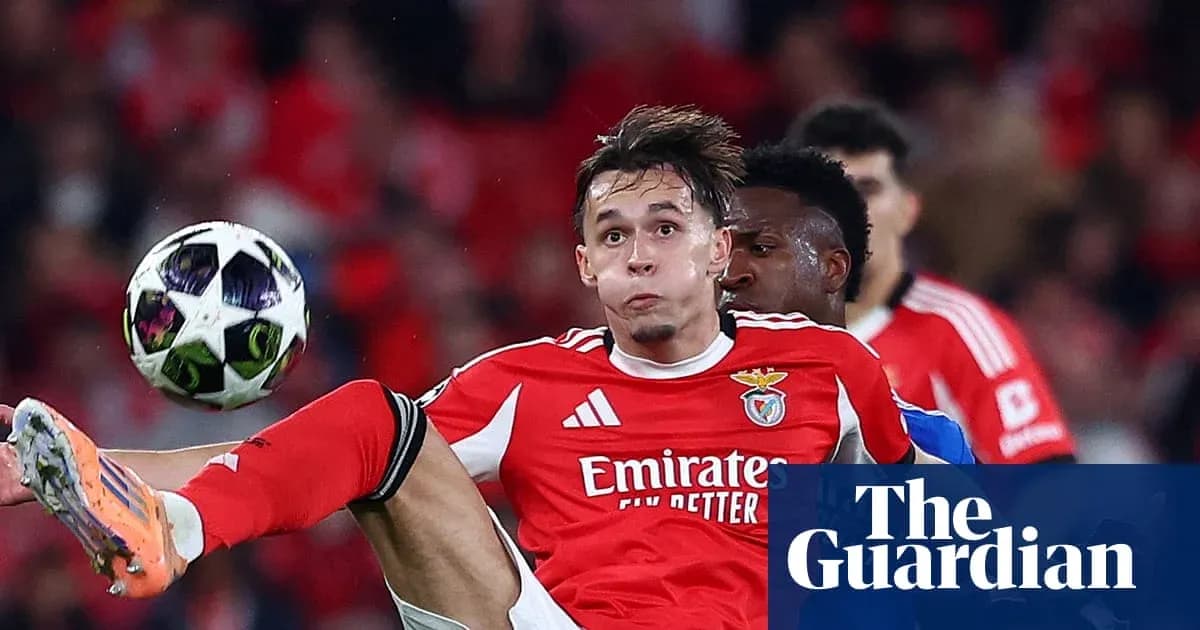 Benfica player kicking ball during match action Benfica player kicking ball during match action