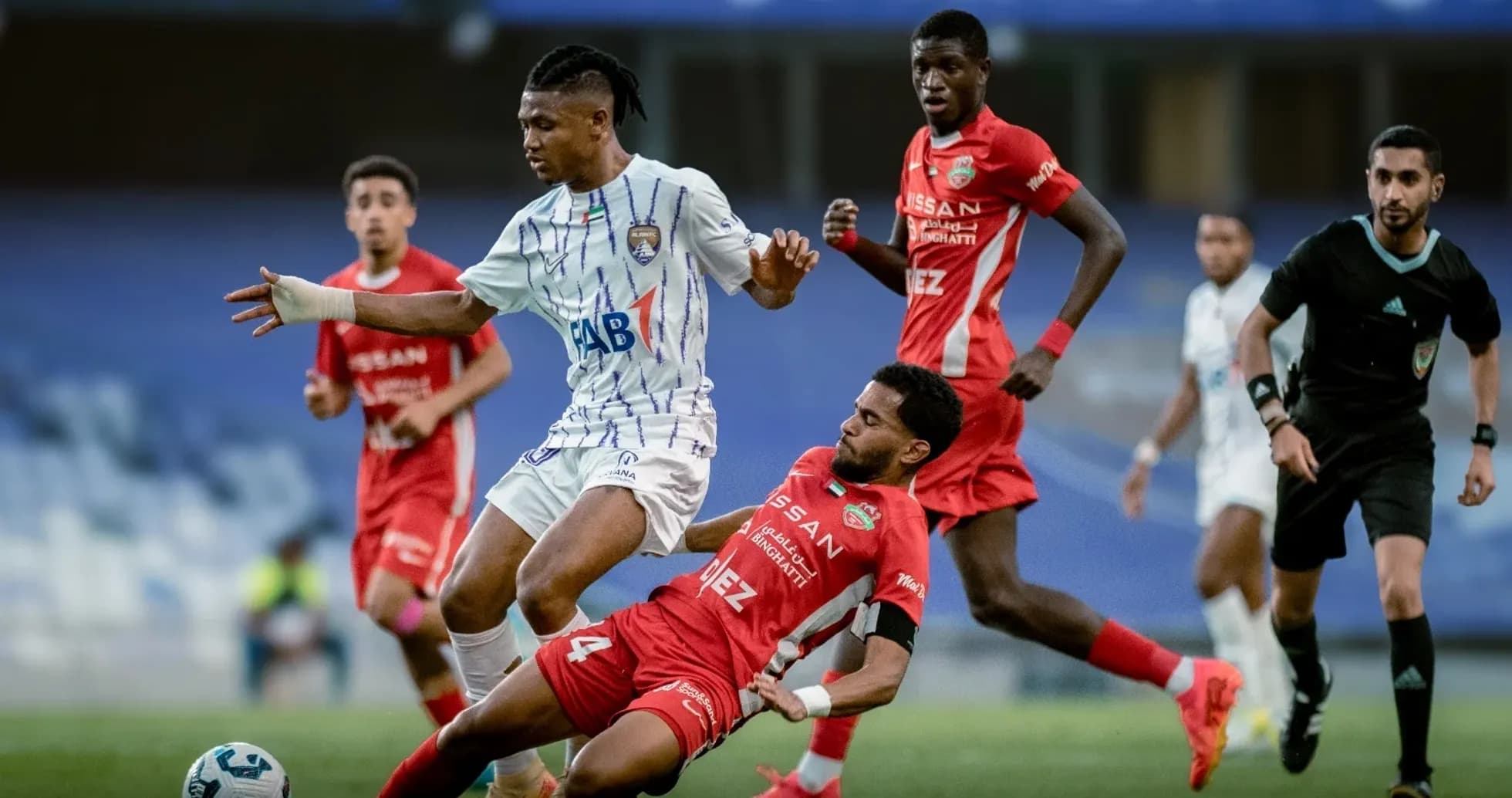 Al Ain U23 player dribbling past Al Sharjah U23 defender Al Ain U23 player dribbling past Al Sharjah U23 defender