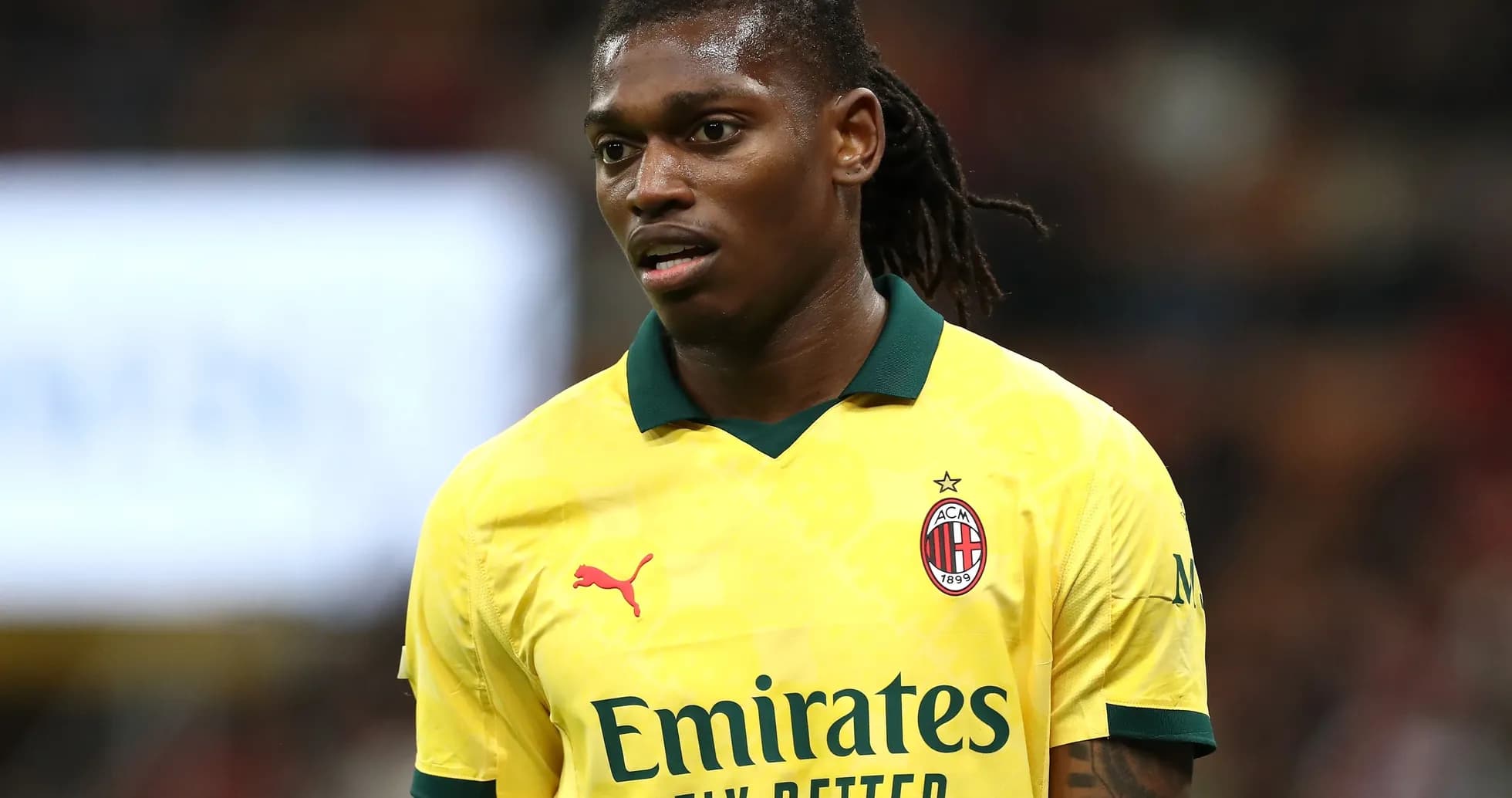Player wearing yellow AC Milan jersey during match Player wearing yellow AC Milan jersey during match