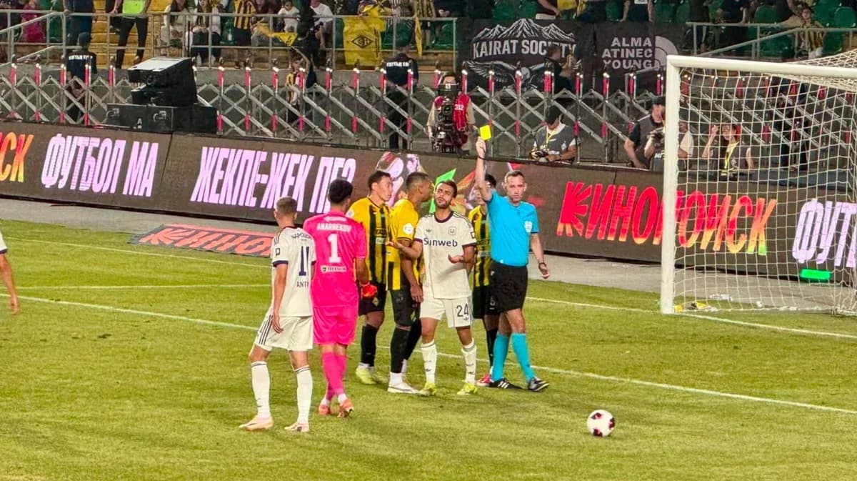 Players interacting with referee during Kairat match Players interacting with referee during Kairat match