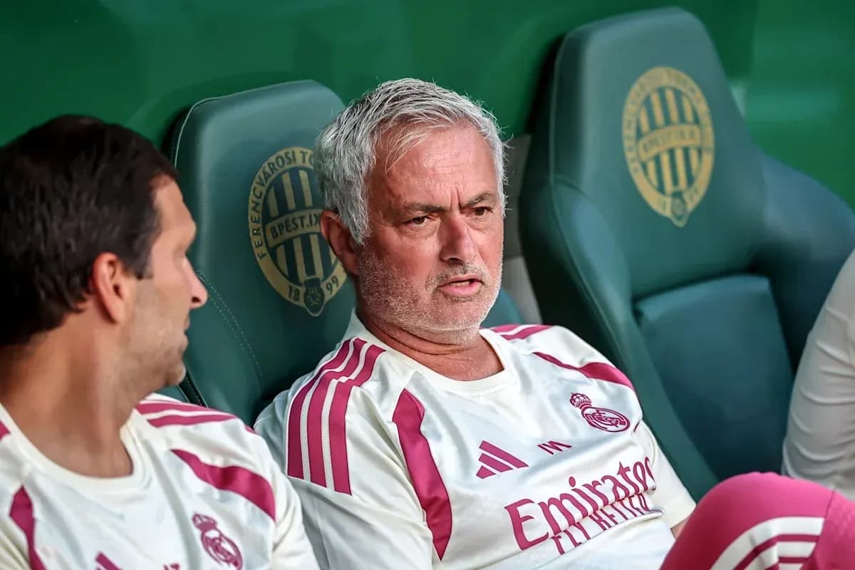 Coach and player seated on bench during match Coach and player seated on bench during match