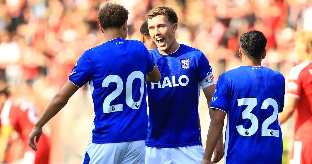 Three players celebrating during a football match Three players celebrating during a football match