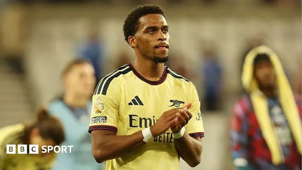 Player applauding fans after match wearing Arsenal jersey Player applauding fans after match wearing Arsenal jersey