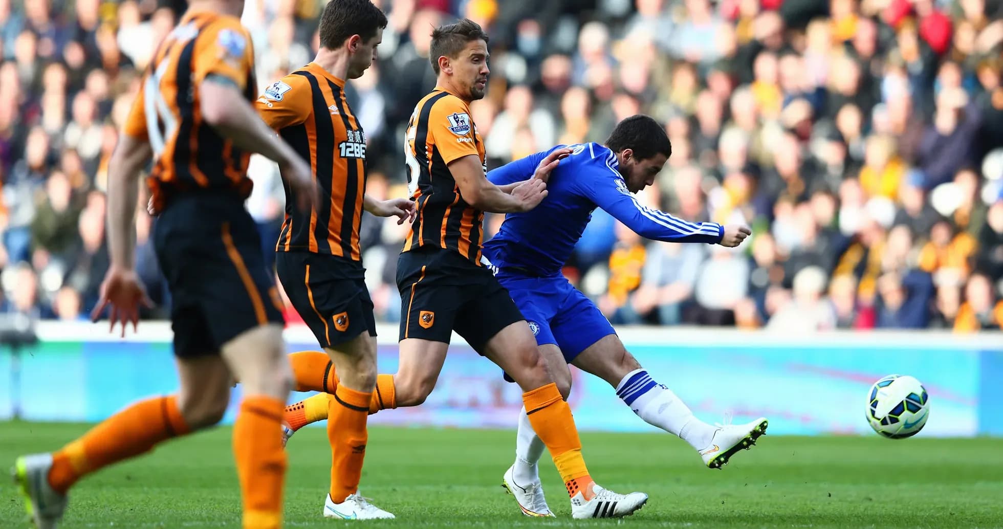 Chelsea player attempting to shoot against Hull City Chelsea player attempting to shoot against Hull City