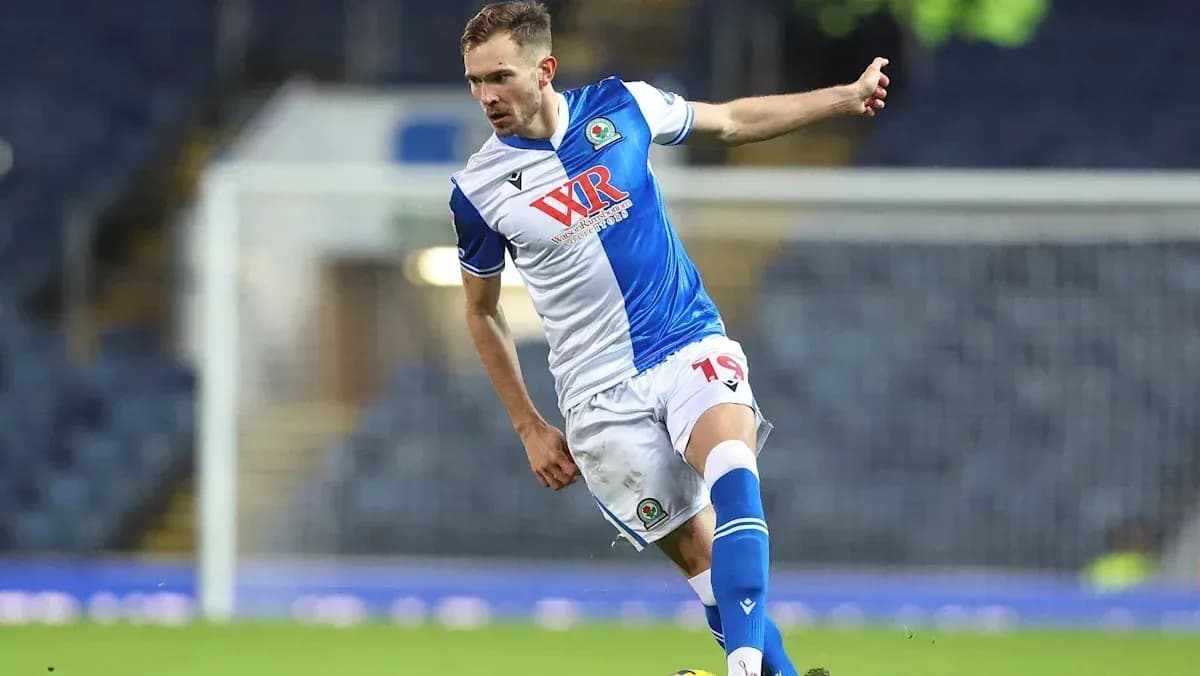 Player kicking the ball during a football match Player kicking the ball during a football match