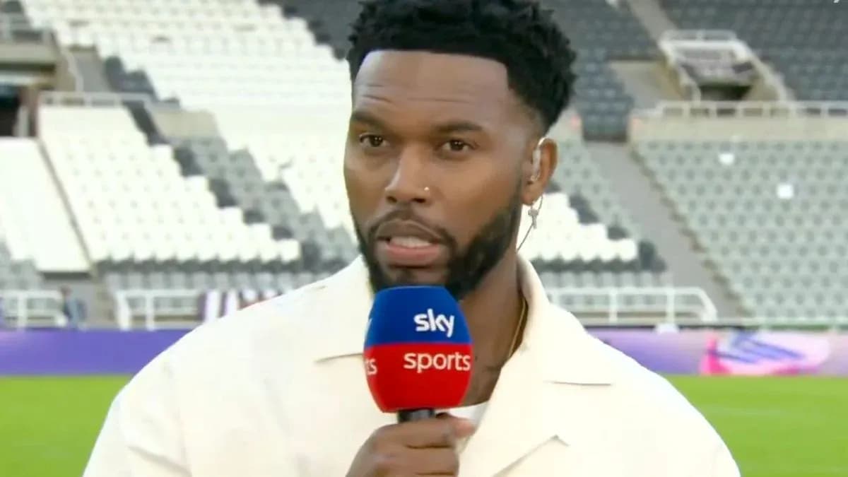 Presenter speaking into microphone on stadium field Presenter speaking into microphone on stadium field