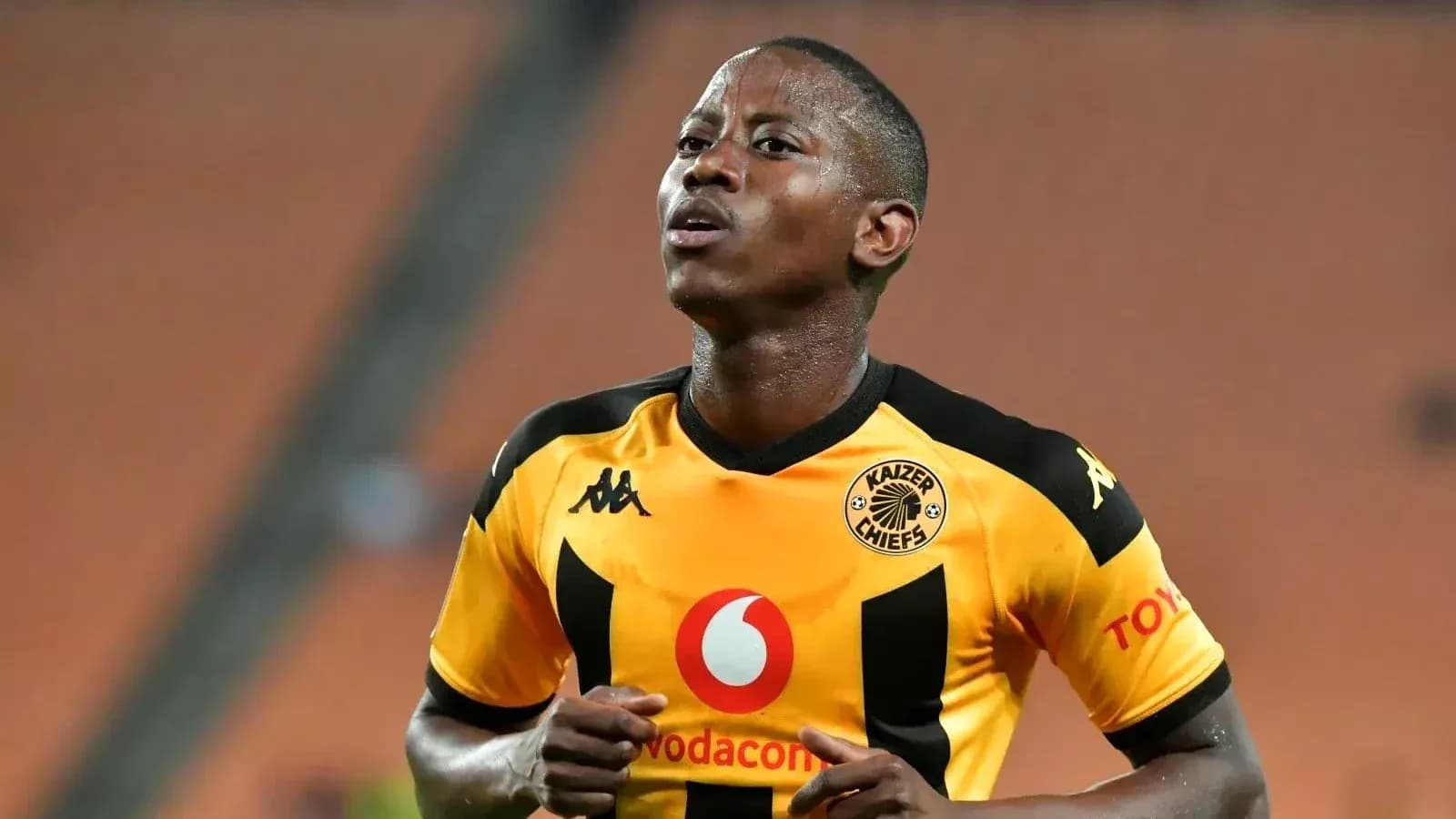 Player in Kaizer Chiefs jersey during a match Player in Kaizer Chiefs jersey during a match