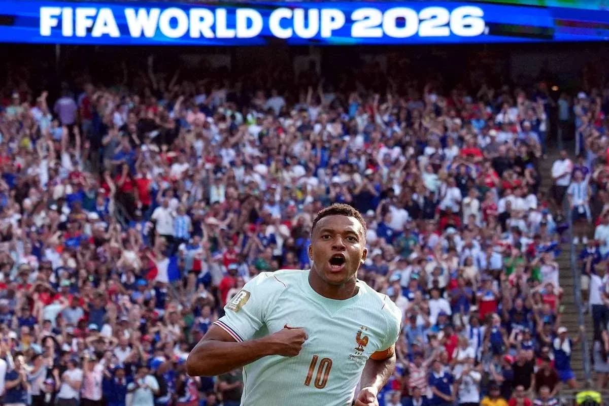 Player celebrating in front of cheering crowd at FIFA World Cup Player celebrating in front of cheering crowd at FIFA World Cup