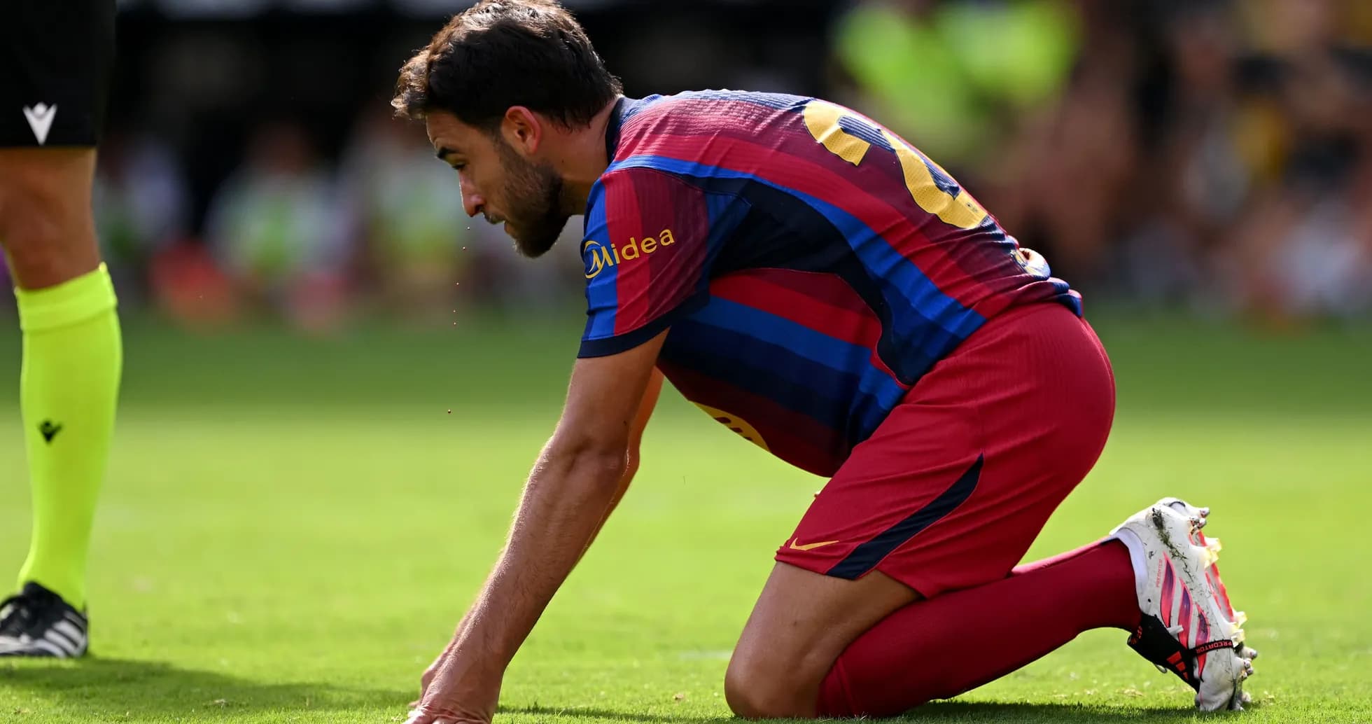 Player kneeling on field during a match Player kneeling on field during a match