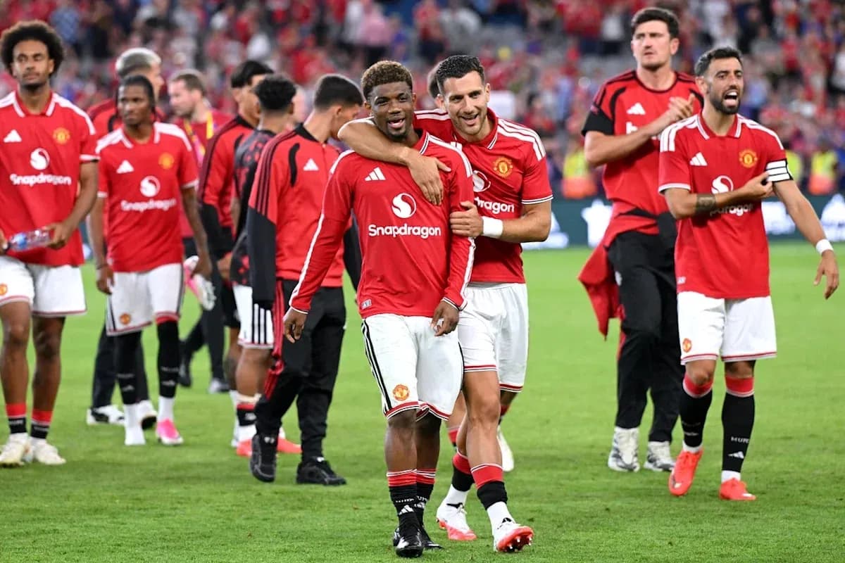 Manchester United players celebrating after a match Manchester United players celebrating after a match