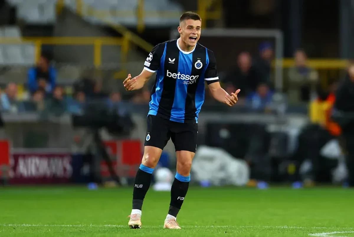 Player gesturing during a Champions League match Player gesturing during a Champions League match