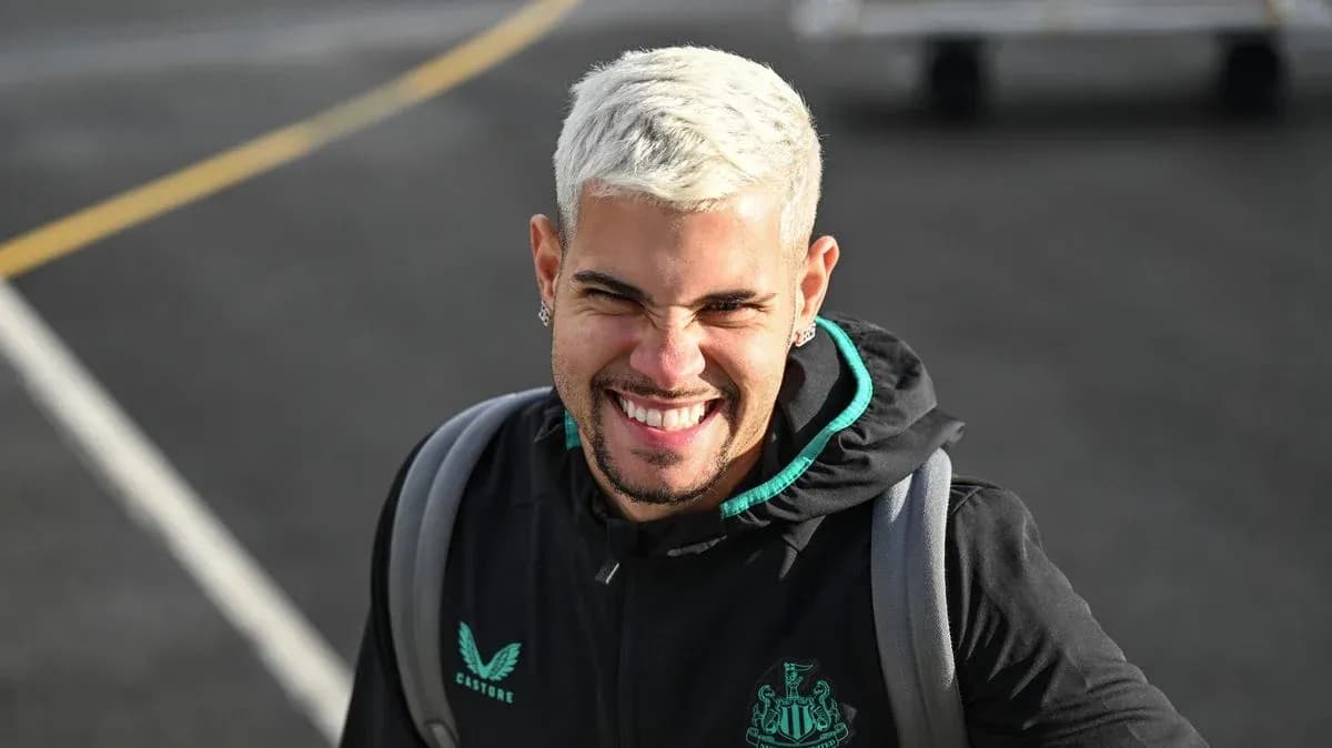 Player smiling while wearing Newcastle training jacket Player smiling while wearing Newcastle training jacket