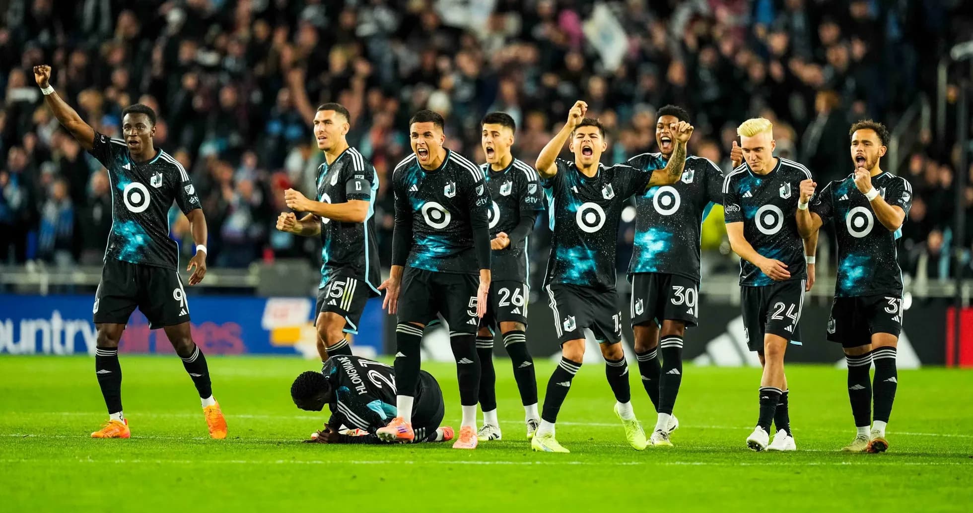Minnesota United FC players celebrating a goal Minnesota United FC players celebrating a goal