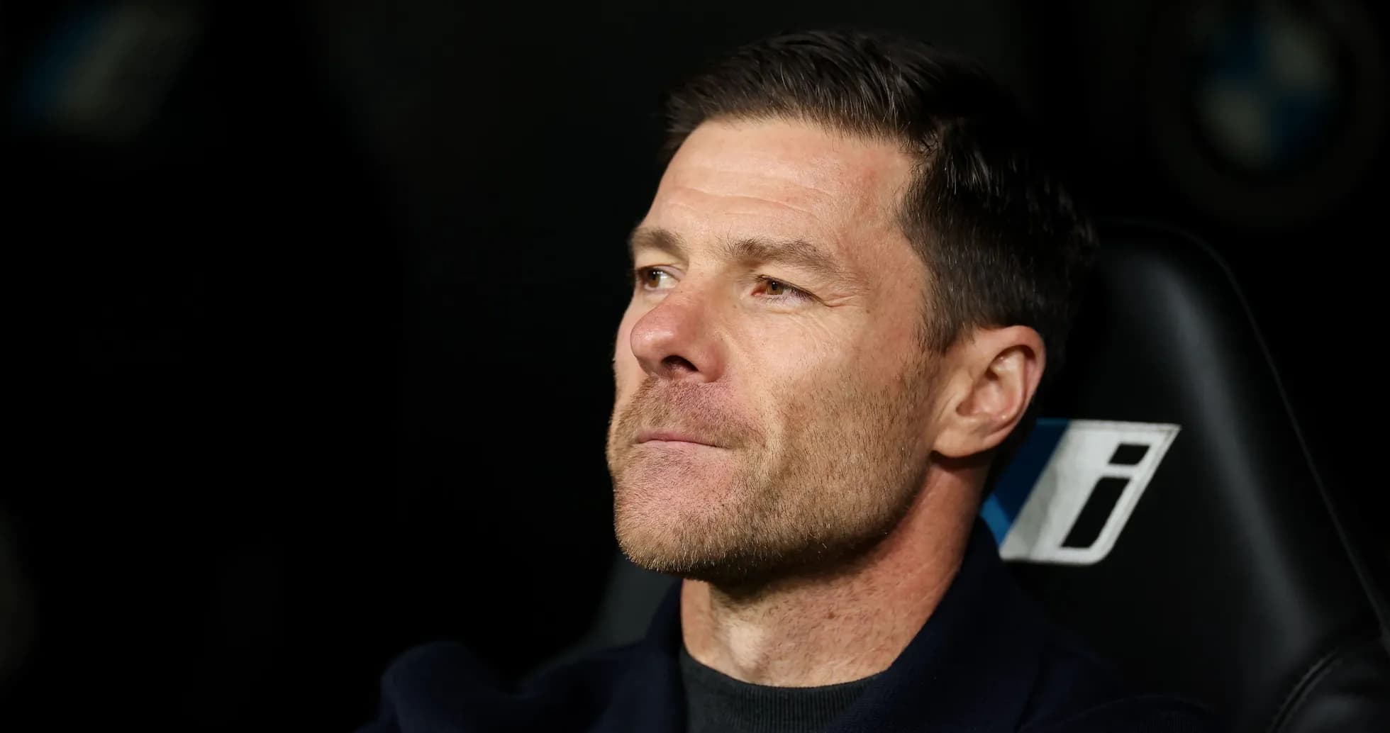 Coach sitting on bench during match Coach sitting on bench during match