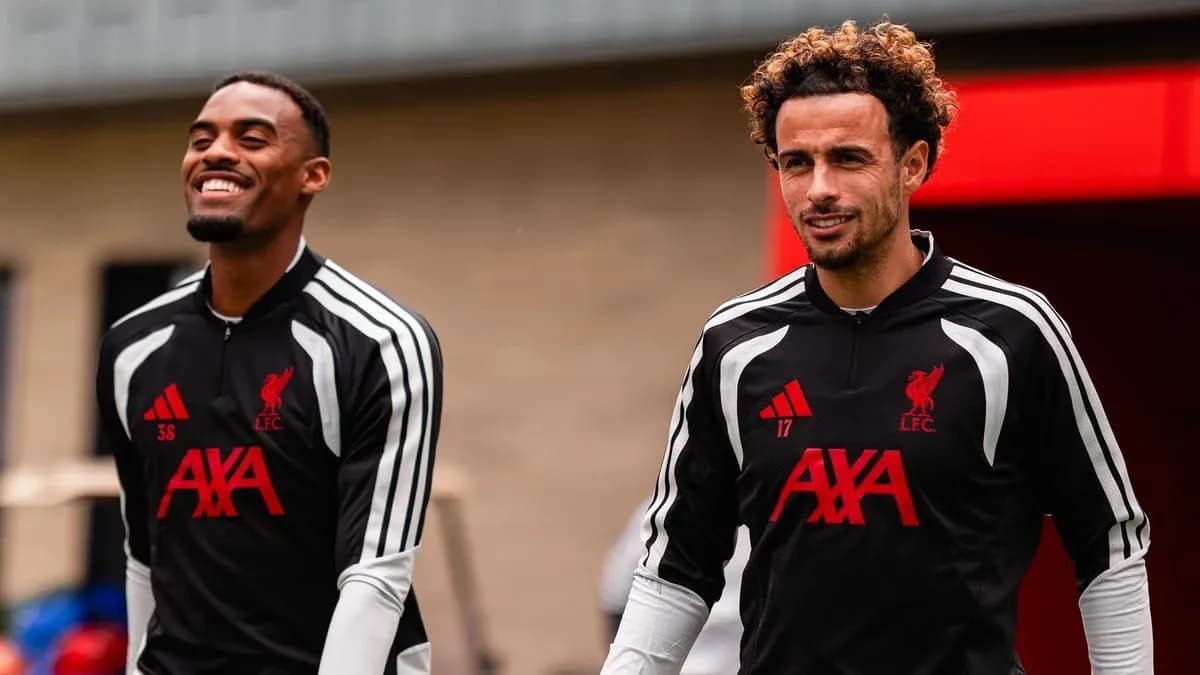 Two Liverpool players walking during training session Two Liverpool players walking during training session
