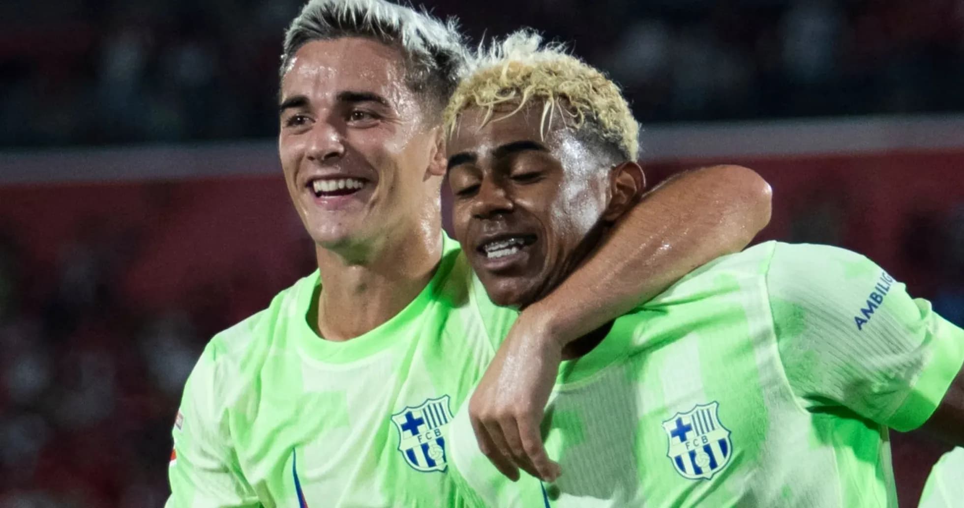 Two players celebrating together after scoring Two players celebrating together after scoring