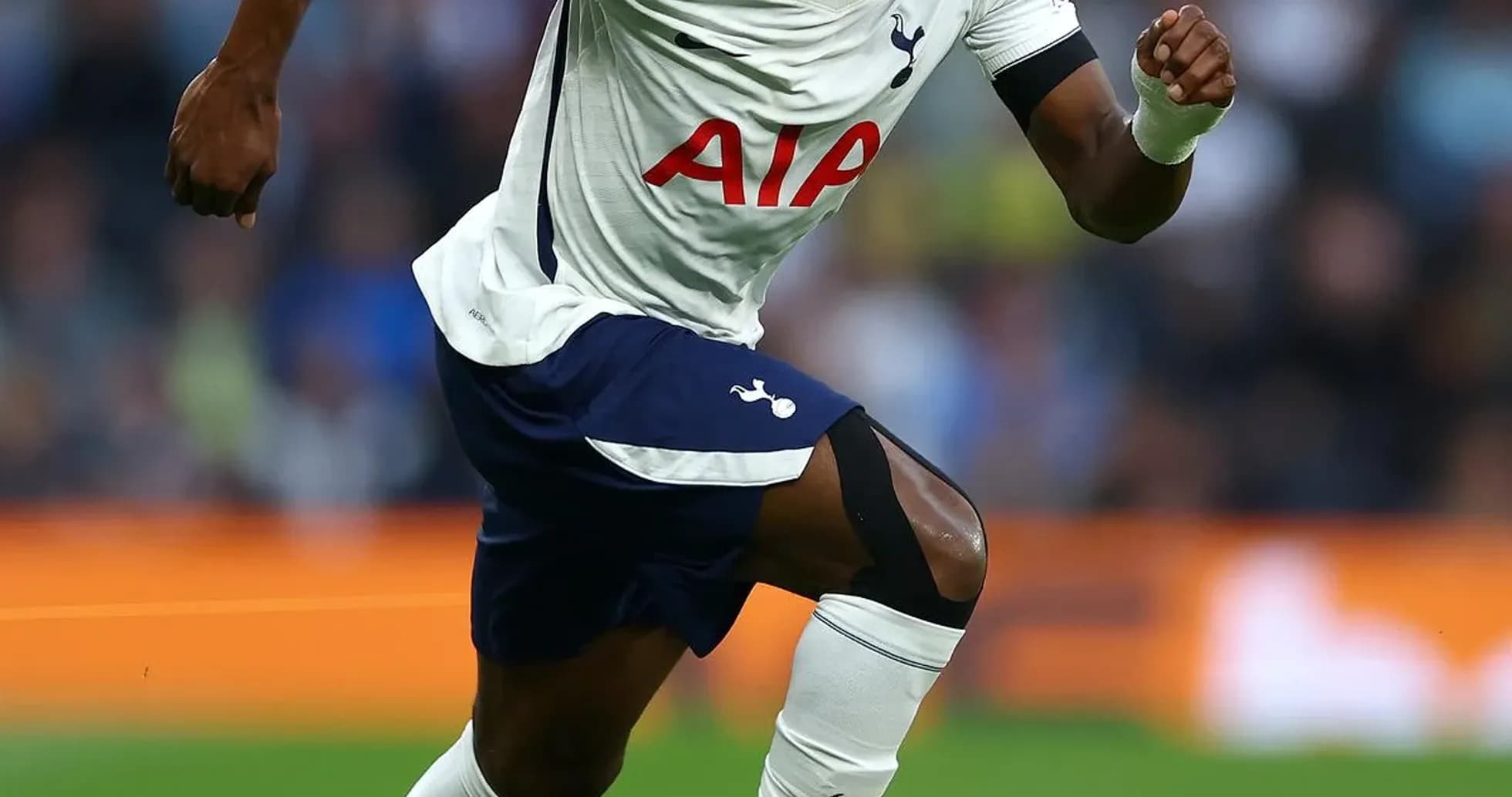 Player sprinting on field during match for Tottenham Player sprinting on field during match for Tottenham