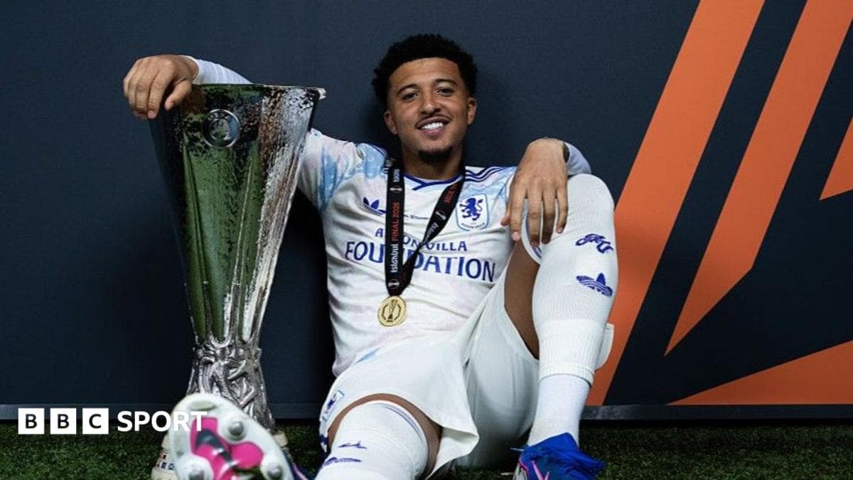 Player celebrating with trophy after winning tournament Player celebrating with trophy after winning tournament