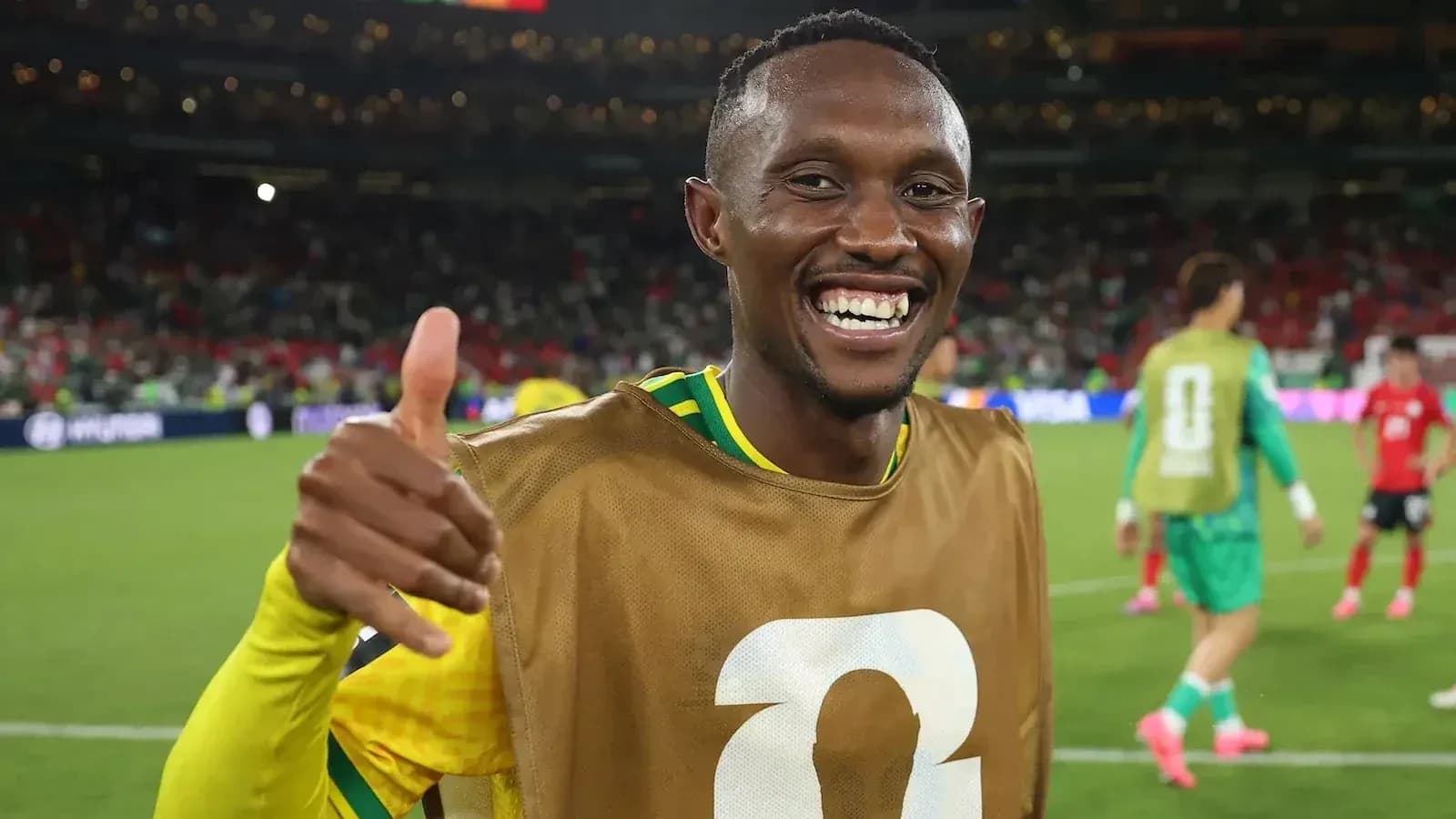 Player smiling and giving thumbs up on field Player smiling and giving thumbs up on field