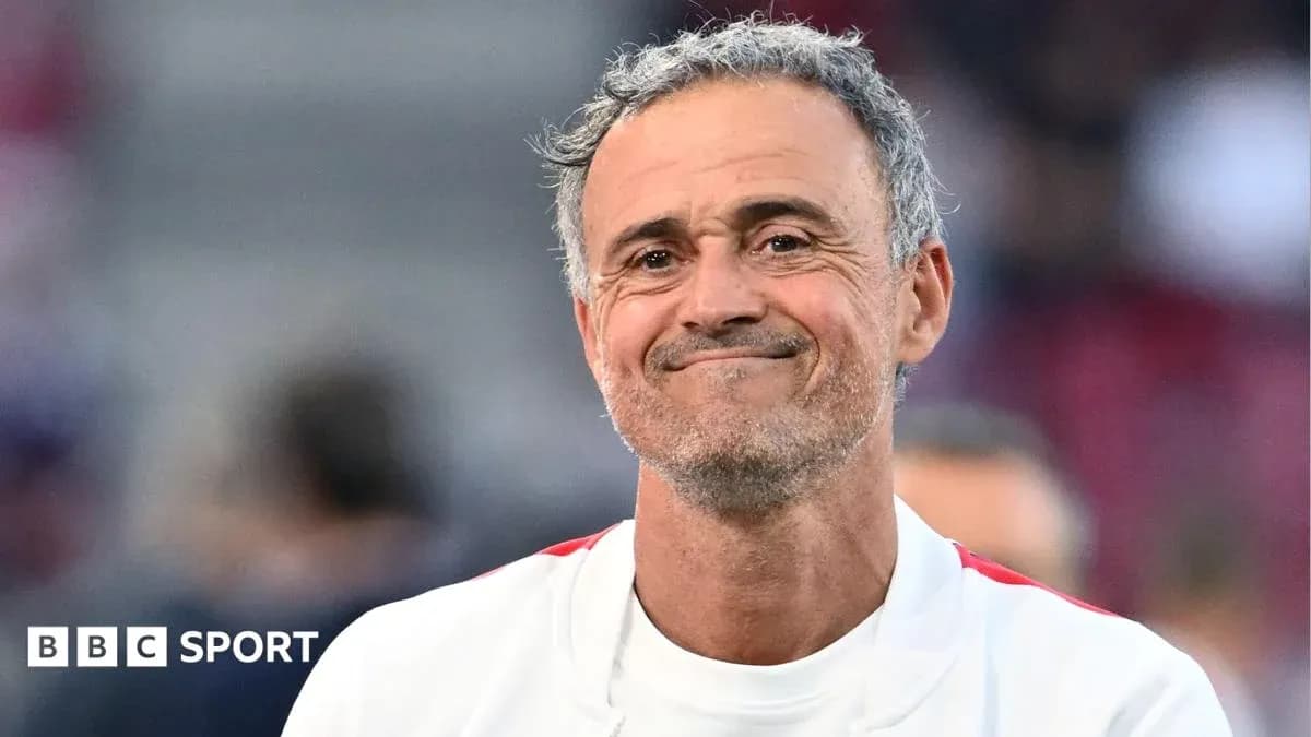 Coach smiling during match warm-up on field Coach smiling during match warm-up on field